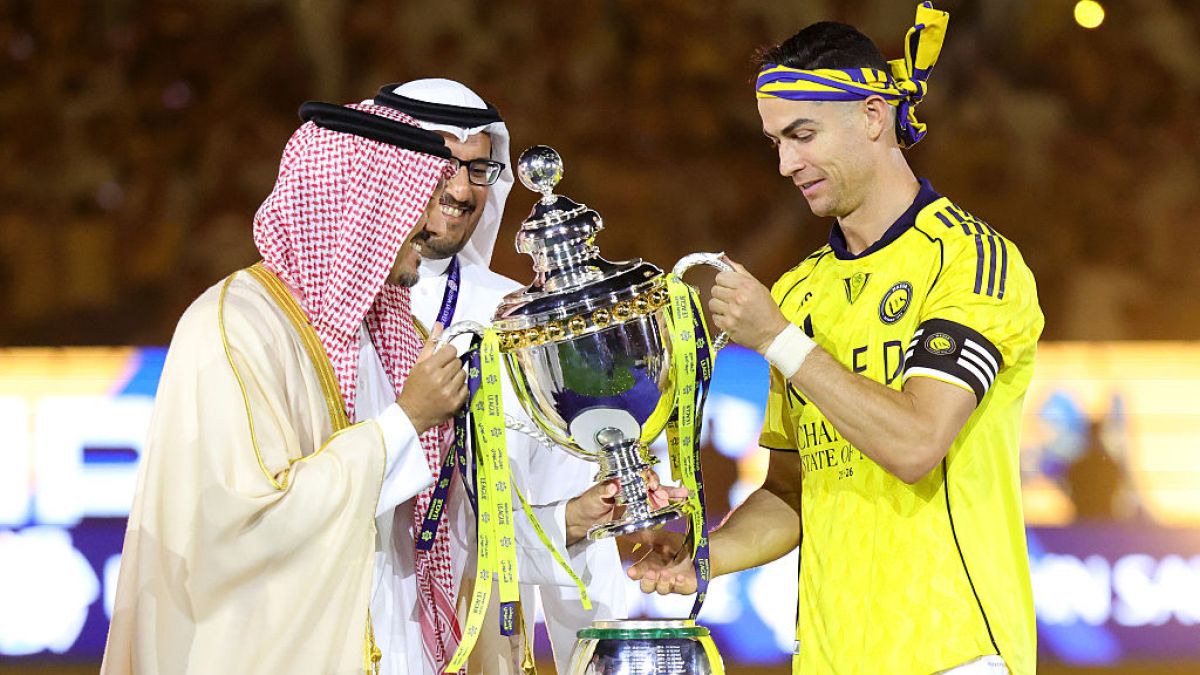 Cristiano Ronaldo, as Al Nassr captain, receiving the Saudi Pro League trophy in 2026